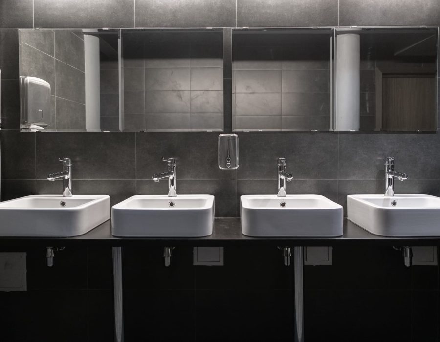 faucets-with-washbasin-in-public-restroom-in-grey-2024-11-03-00-47-34-utc.jpg